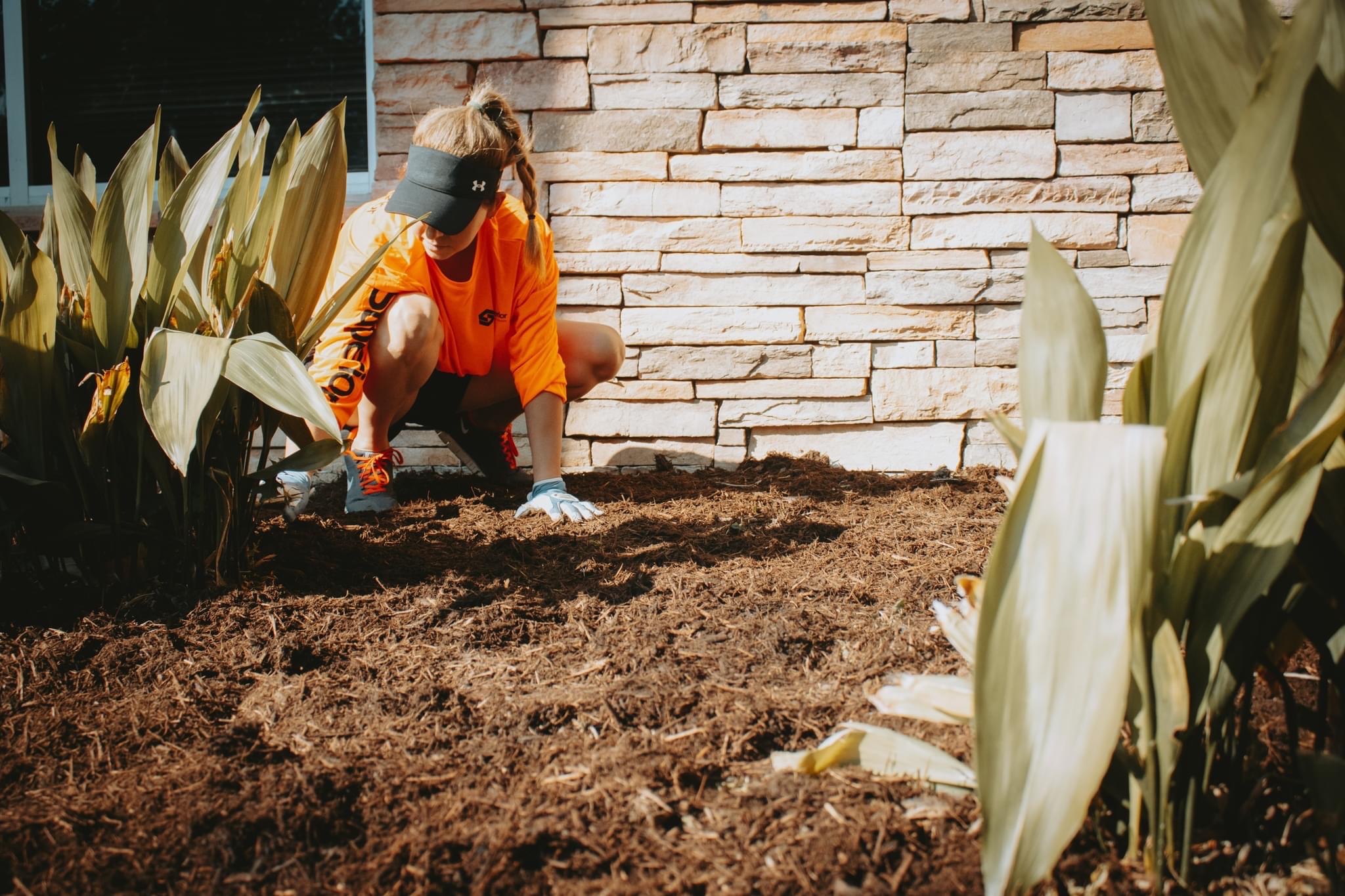 Laying mulch at Midlothian Senior Center